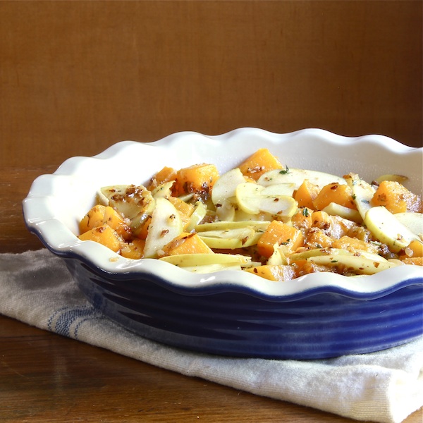 Butternut squash and apple crumble casserole in a deep pie dish.