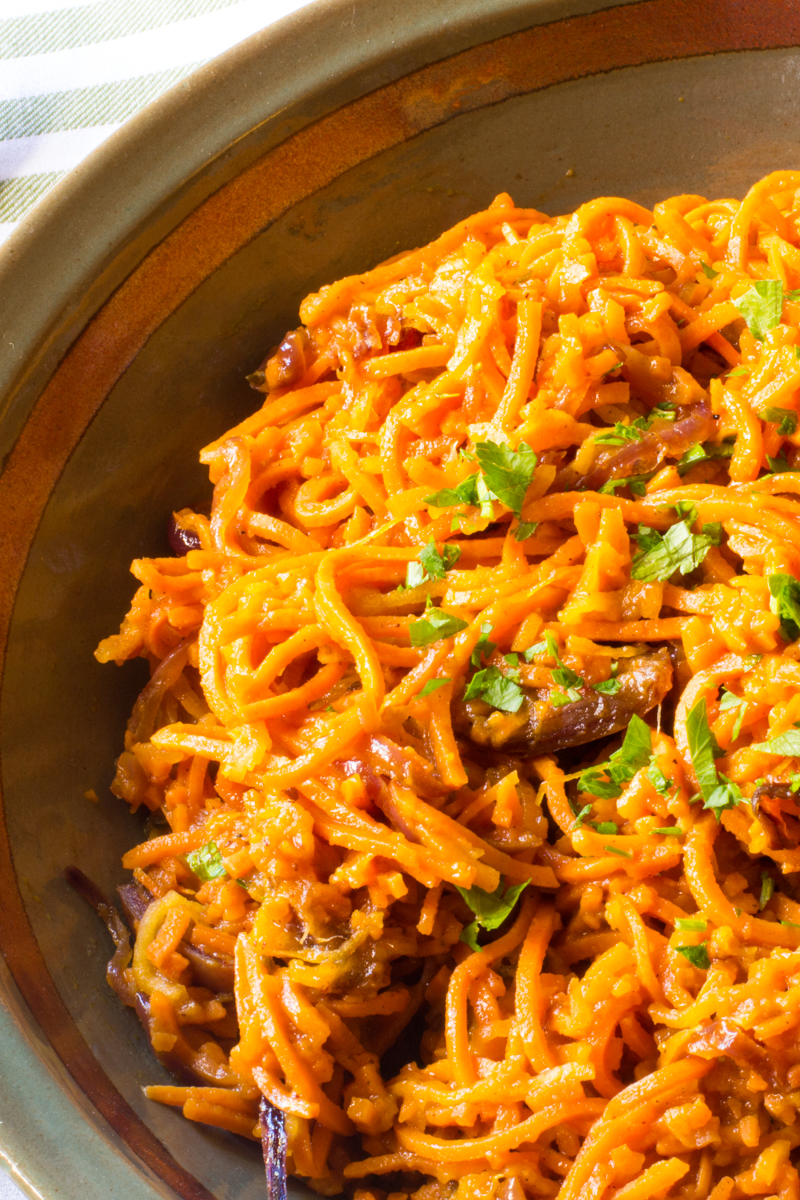 Spiralized sweet potatoes and apples sautéed in browned butter with caramelized onions, and dates. 