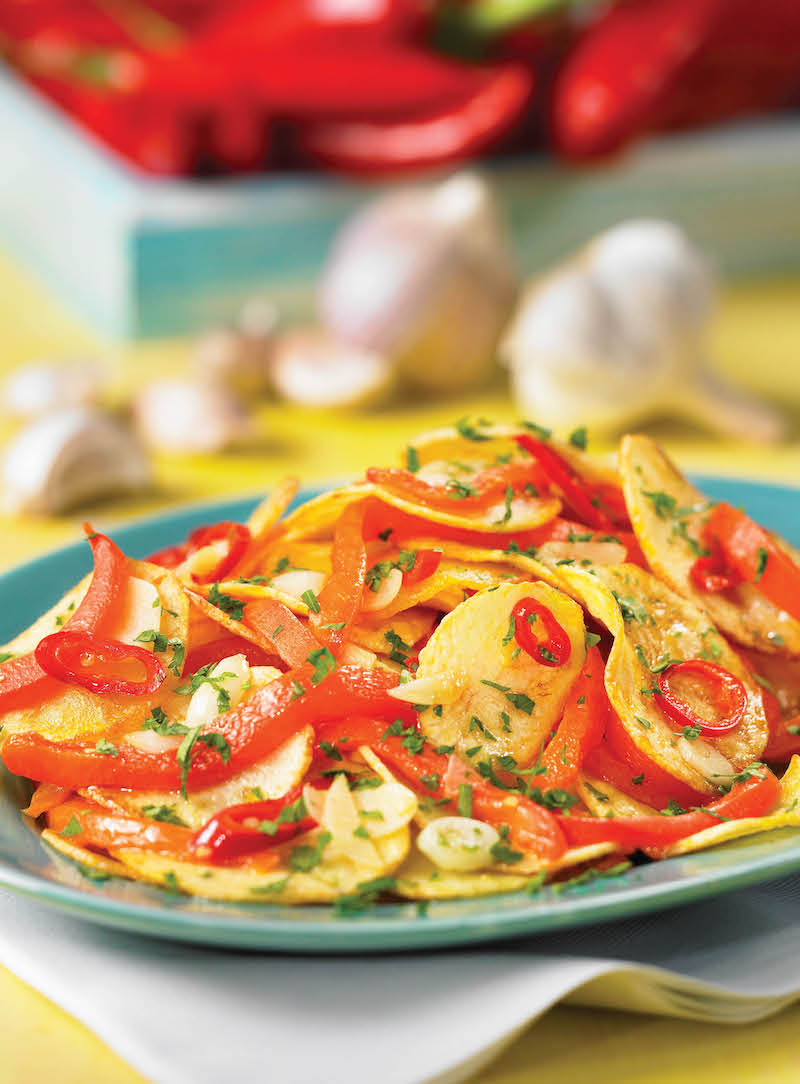 Fried potatoes with medium-spiced peppers and garlic.