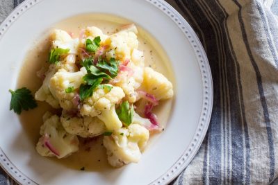 A twist on shrimp scampi using cauliflower, with ideas on how to turn it into a main meal, and how to make vegan.