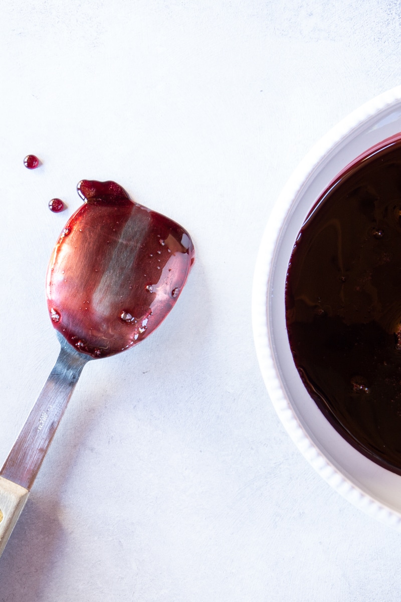 Instructions and tips for making the best pomegranate molasses you've ever had with 3 ingredients and an optional spice + ways to use this Middle Eastern ingredient. 