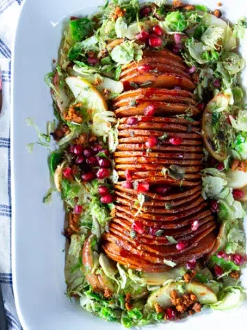 Delicious, gorgeous vegan entrée for Thanksgiving or any special occasion. Step-by-step instructions to hasselback butternut squash are included, with photos for each step.