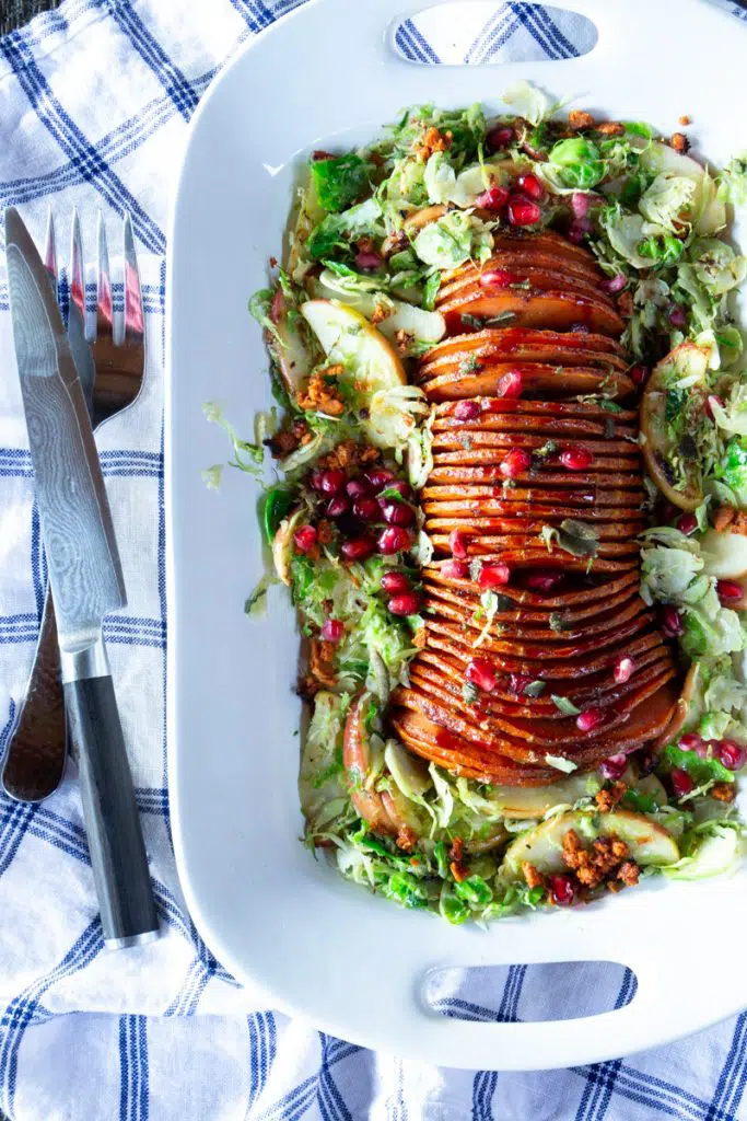 Delicious, gorgeous vegan entrée for Thanksgiving or any special occasion. Step-by-step instructions to hasselback butternut squash are included, with photos for each step.