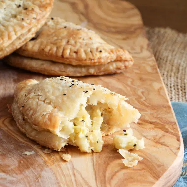 Vegetarian Cornish pasties filled with potatoes, celery root and pickled apples.