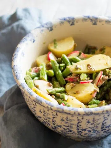 Potato salad with asparagus, radishes and lentils.