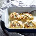 A baking dish of double baked cheese soufflés with artichokes.