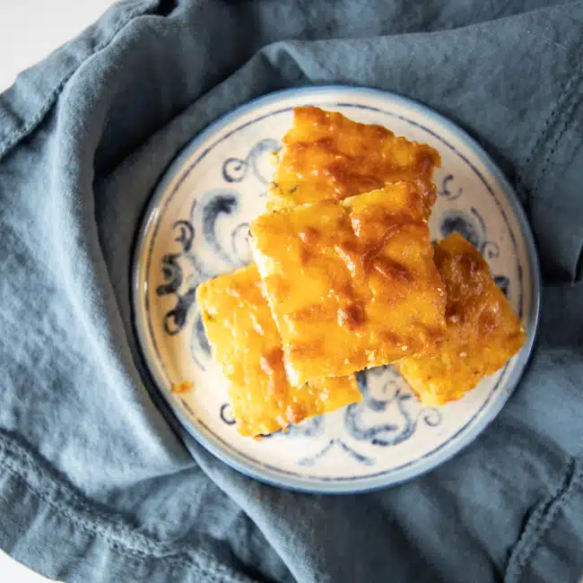 Top view of a stack of Mexican cornbread slices.