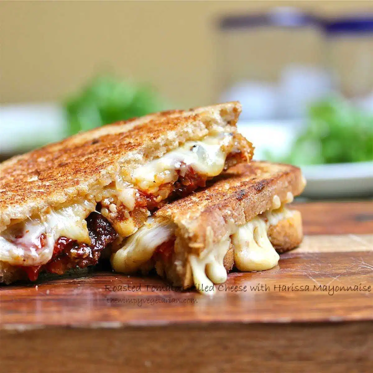 Grilled cheese sandwich filled with tomatoes and harissa mayonnaise.