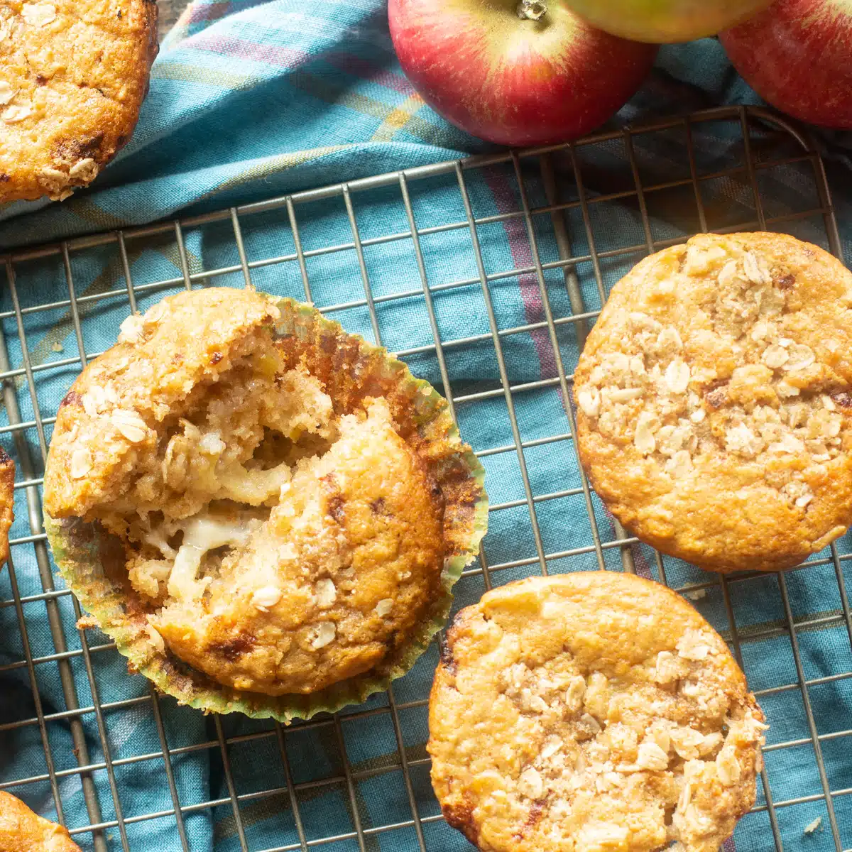 Top view of apple oatmeal muffins with cheddar cheese on a cooling rack.