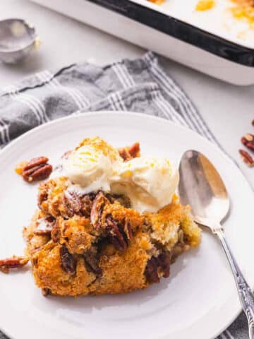 A piece of pecan cobbler on a plate.